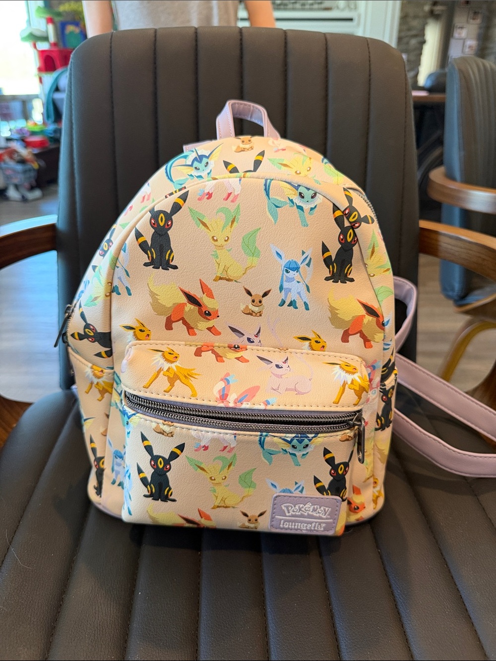 Loungefly Mini Backpack with Multicolor Eeveelutions on Cream-never used